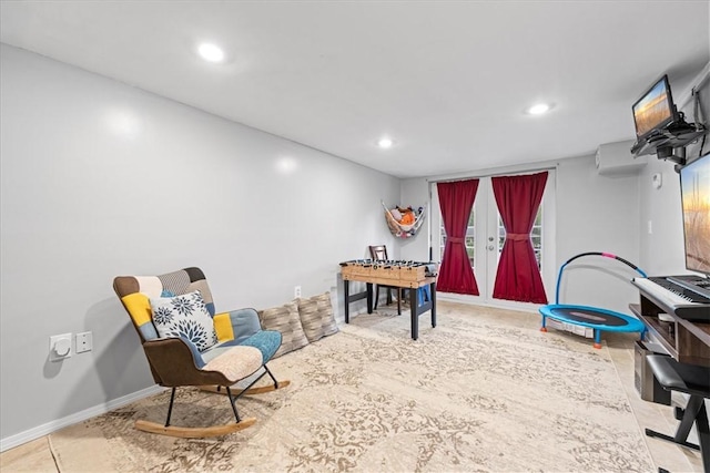 playroom featuring a wall unit AC, baseboards, and recessed lighting