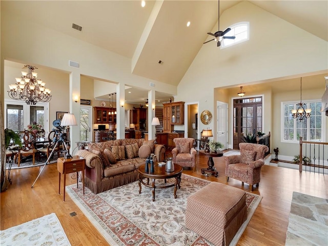 105 Green Cove Way, Six Mile, SC 29682 - living room featuring high vaulted ceiling, visible vents, ceiling fan with notable chandelier, and light wood-type flooring