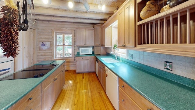 191 Crystal Ln, Townville, SC 29689 - kitchen featuring a sink, light wood-style flooring, rustic walls, white appliances, and beamed ceiling
