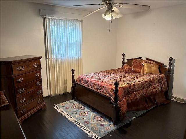 bedroom featuring dark wood-style floors and a ceiling fan