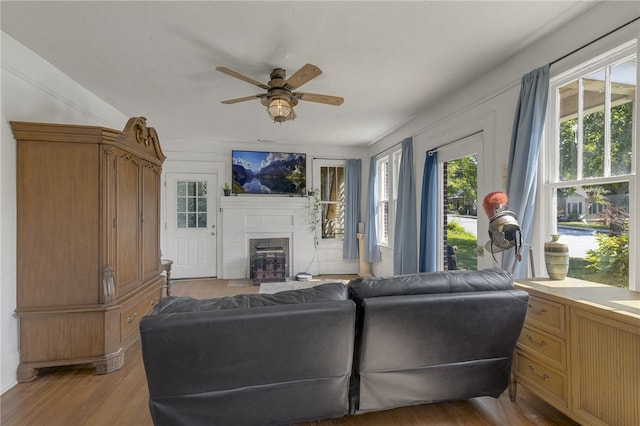 268 Ann St, Pickens, SC 29671 - living room with ceiling fan, a fireplace, and light wood finished floors