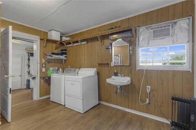 268 Ann St, Pickens, SC 29671 - laundry room with independent washer and dryer, wooden walls, light wood-style floors, ornamental molding, and a textured ceiling