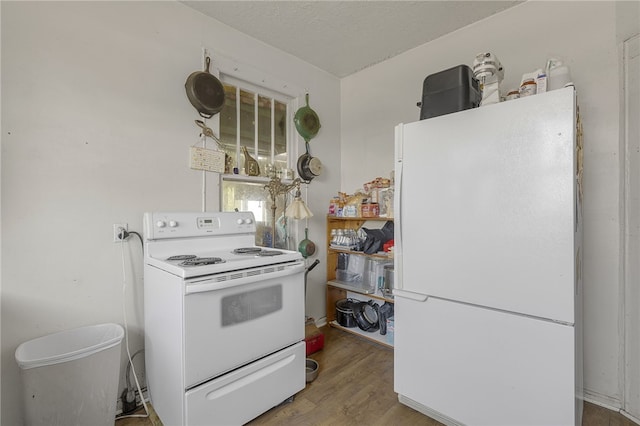 268 Ann St, Pickens, SC 29671 - kitchen with white appliances and wood finished floors