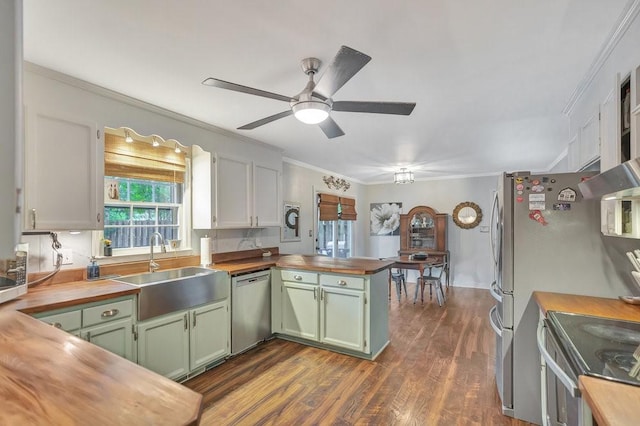 224 Regency Cir, Anderson, SC 29625 - kitchen featuring wooden counters, green cabinetry, a peninsula, and appliances with stainless steel finishes