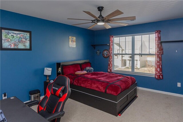 bedroom with baseboards, carpet floors, ceiling fan, and multiple windows