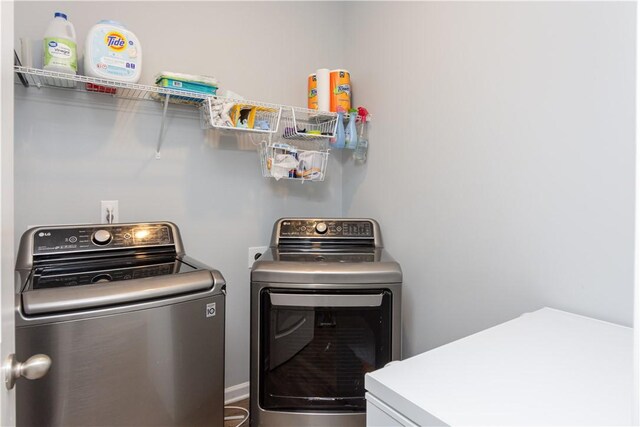 laundry area featuring washing machine and dryer and laundry area