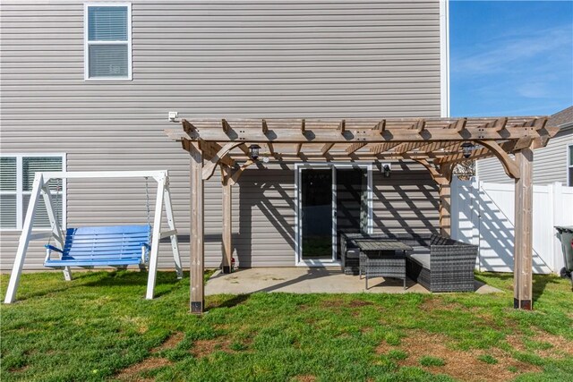doorway to property with a lawn, a pergola, fence, and a patio area