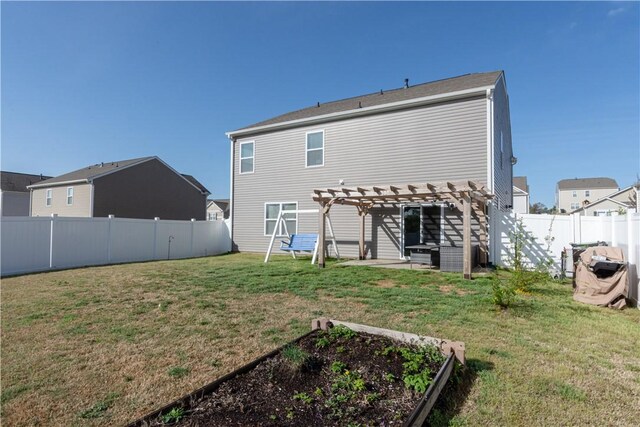 back of property with a pergola, a yard, and a fenced backyard