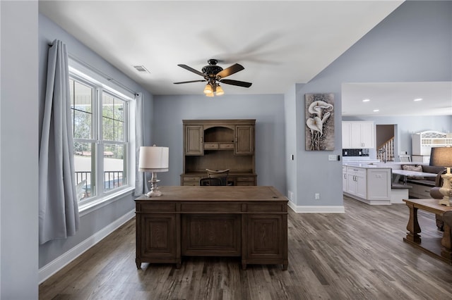office space with baseboards, visible vents, wood finished floors, and ceiling fan