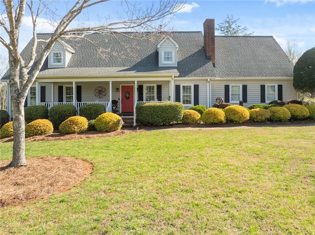 cape cod-style house featuring covered porch, roof with shingles, and a front lawn