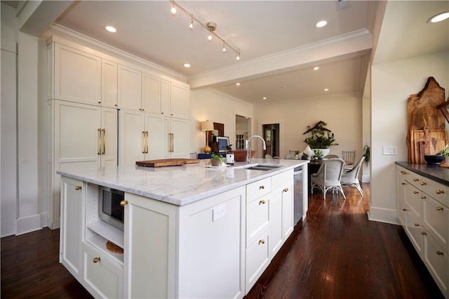 kitchen featuring white cabinetry, a sink, stainless steel appliances, and dark wood-style floors