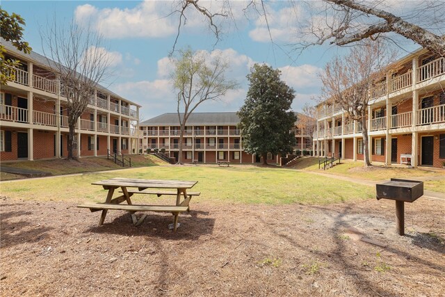 view of home's community with a lawn