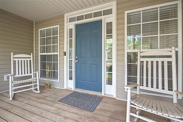 view of exterior entry featuring a porch
