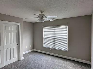 235 Lookover Dr, Anderson, SC 29621 - spare room with carpet, ceiling fan, and a textured ceiling