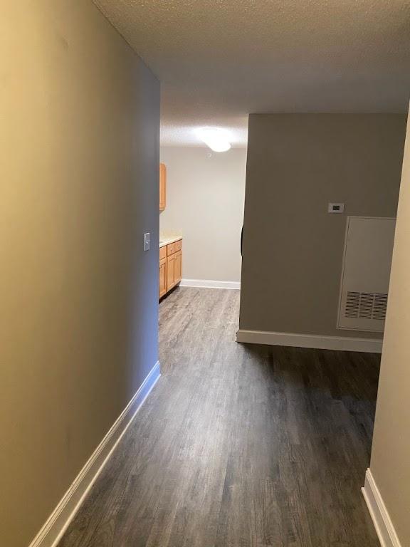 235 Lookover Dr, Anderson, SC 29621 - hall featuring dark wood-type flooring and a textured ceiling