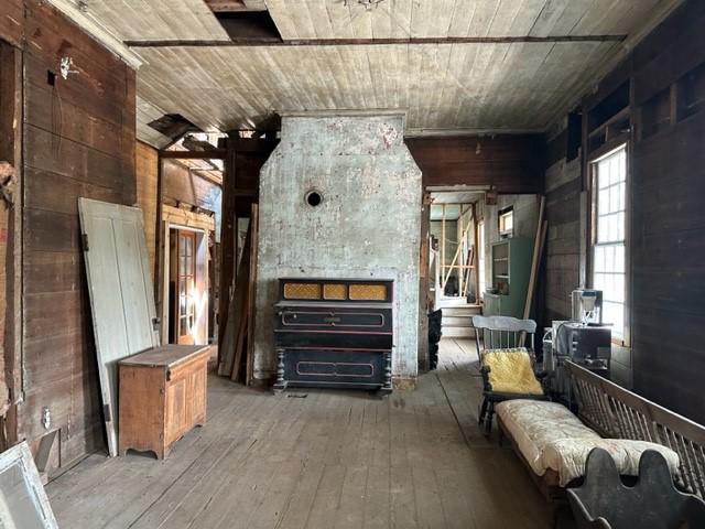 171 E Main St, Pendleton, SC 29670 - unfurnished room featuring wood walls, wood ceiling, and wood-type flooring