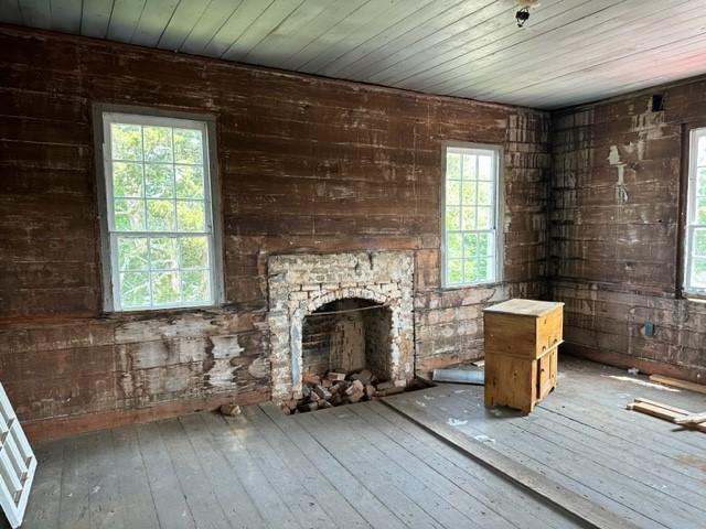 171 E Main St, Pendleton, SC 29670 - unfurnished living room with wood ceiling, hardwood / wood-style flooring, and a healthy amount of sunlight