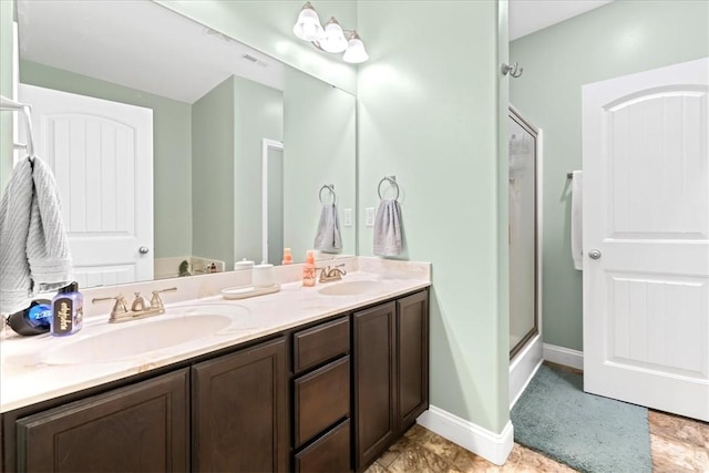 185 Norfolk Cir, Anderson, SC 29625 - full bathroom featuring a shower stall, double vanity, baseboards, and a sink