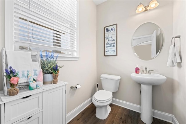 185 Norfolk Cir, Anderson, SC 29625 - half bathroom with toilet, a sink, baseboards, and wood finished floors