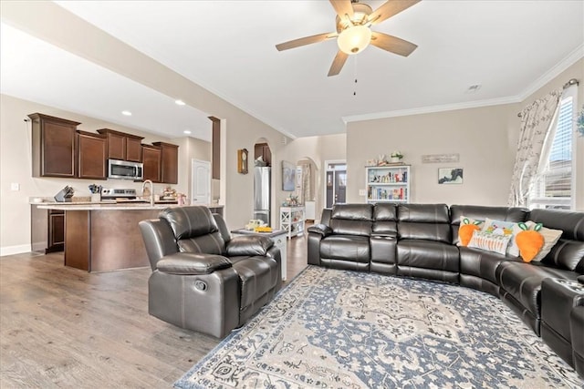 185 Norfolk Cir, Anderson, SC 29625 - living area featuring light wood finished floors, arched walkways, ornamental molding, and a ceiling fan