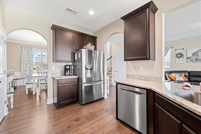 185 Norfolk Cir, Anderson, SC 29625 - kitchen with arched walkways, appliances with stainless steel finishes, and dark brown cabinetry