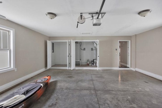 garage featuring baseboards and a garage door opener