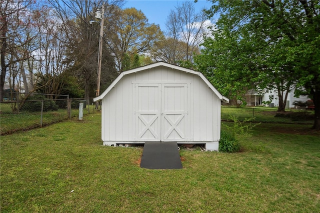view of shed with fence