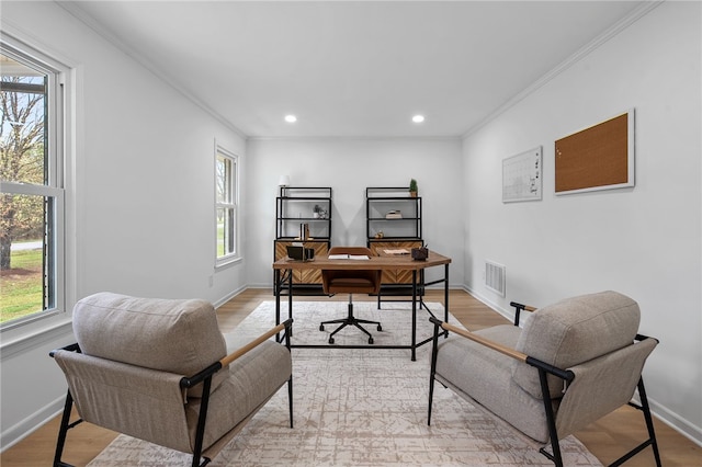 home office with crown molding, light wood-style flooring, baseboards, visible vents, and recessed lighting