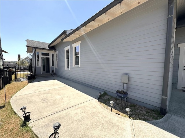 exterior space featuring a patio area and fence