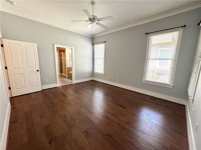 unfurnished bedroom with baseboards, ornamental molding, ceiling fan, connected bathroom, and wood finished floors