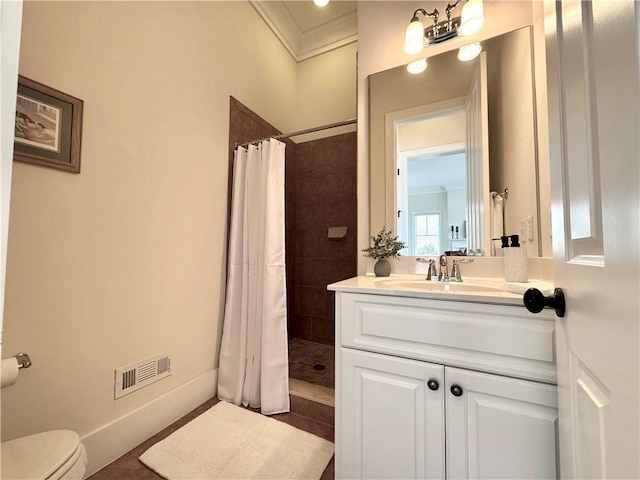 full bathroom with vanity, toilet, visible vents, and a tile shower
