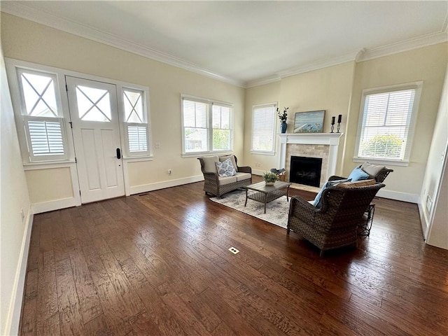 living room with a fireplace, baseboards, ornamental molding, and dark wood-style floors
