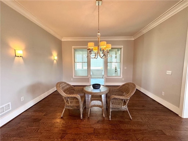 dining area with an inviting chandelier, ornamental molding, baseboards, and visible vents