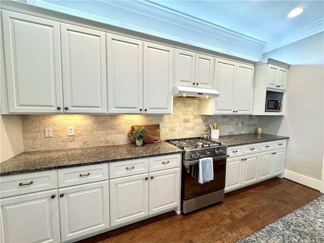 kitchen featuring under cabinet range hood, white cabinets, stainless steel gas stove, and dark wood-style floors