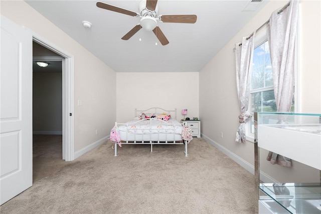 bedroom featuring carpet flooring, baseboards, ceiling fan, and visible vents