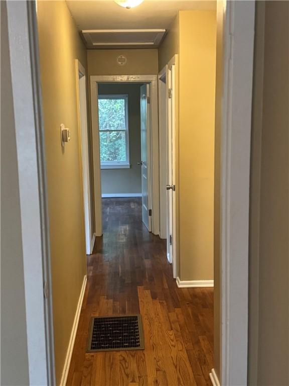 405 Casey St, Anderson, SC 29624 - corridor featuring dark wood-type flooring, visible vents, baseboards, and attic access