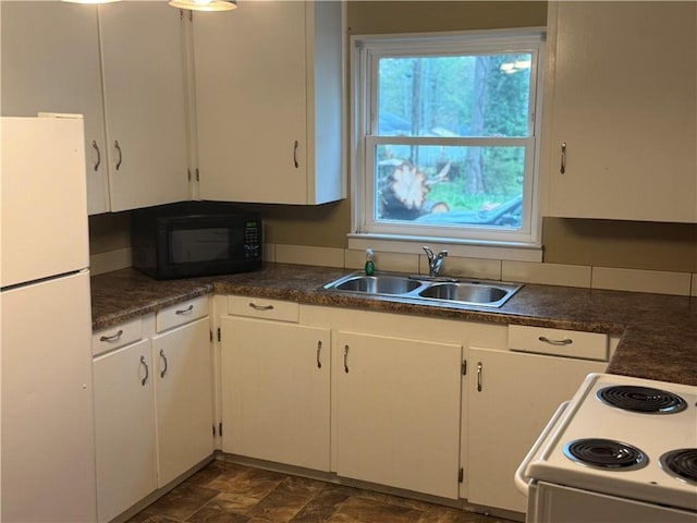 405 Casey St, Anderson, SC 29624 - kitchen with white appliances, a sink, and dark countertops
