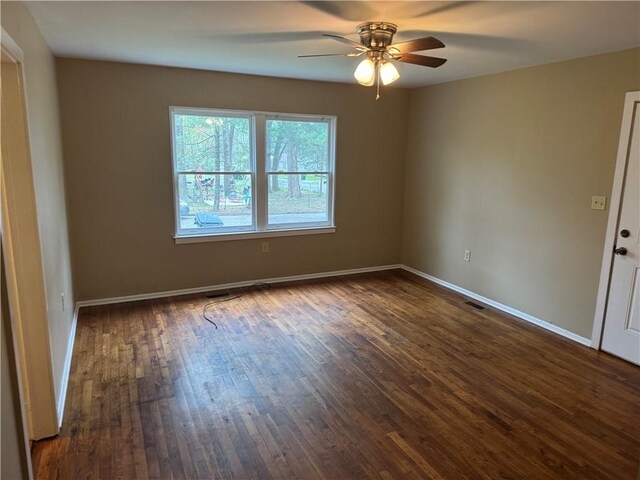 405 Casey St, Anderson, SC 29624 - spare room featuring dark wood-style flooring, baseboards, a ceiling fan, and visible vents