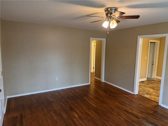 405 Casey St, Anderson, SC 29624 - spare room with dark wood-style floors, baseboards, and a ceiling fan