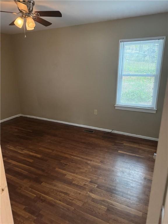 405 Casey St, Anderson, SC 29624 - empty room with visible vents, baseboards, a ceiling fan, and dark wood-style floors