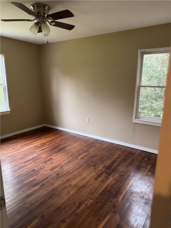 405 Casey St, Anderson, SC 29624 - spare room featuring dark wood-type flooring, baseboards, and a ceiling fan