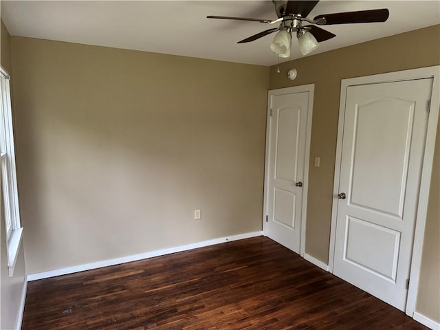 405 Casey St, Anderson, SC 29624 - unfurnished bedroom featuring dark wood-style flooring, baseboards, and a ceiling fan