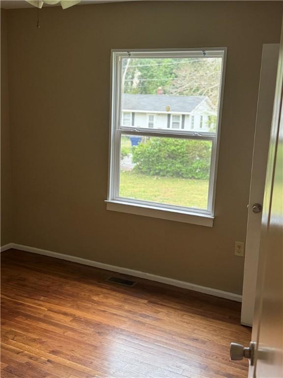 405 Casey St, Anderson, SC 29624 - unfurnished room featuring visible vents, baseboards, and wood finished floors