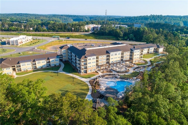 aerial view featuring a wooded view