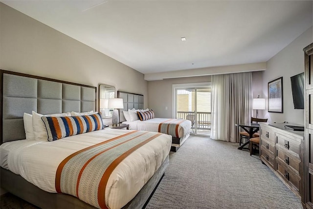 bedroom featuring light carpet and access to outside