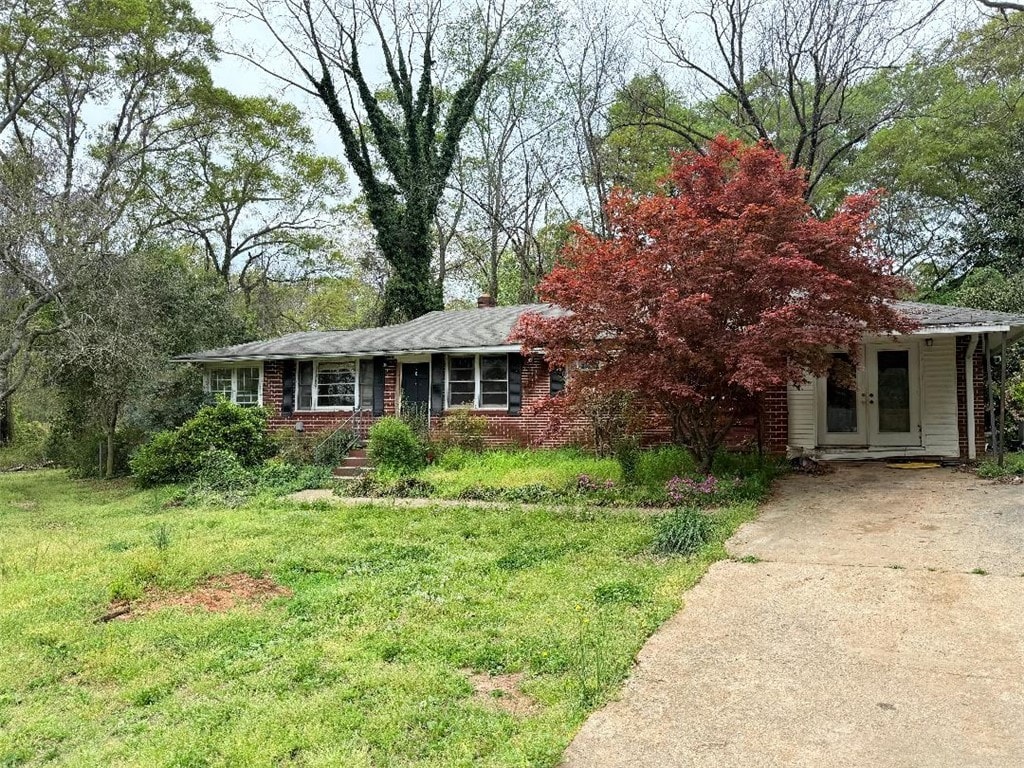 101 Issaqueena Trl, Clemson, SC 29631 - view of front of house featuring brick siding, french doors, a front yard, and concrete driveway