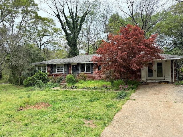 101 Issaqueena Trl, Clemson, SC 29631 - view of front of house featuring brick siding, french doors, a front yard, and concrete driveway