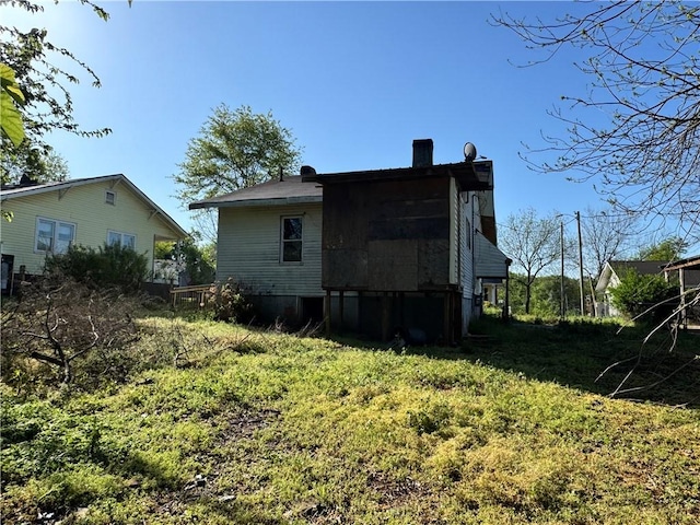 view of side of home with a chimney