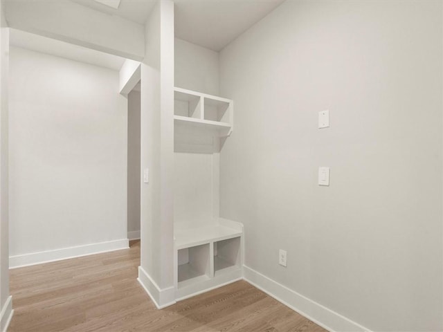 mudroom with baseboards and light wood-type flooring