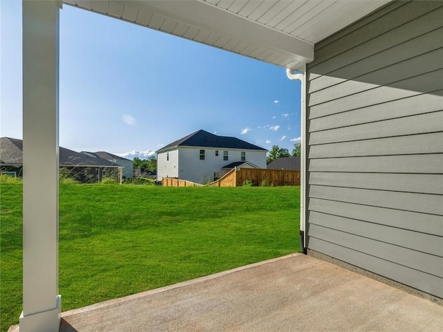 view of grassy yard featuring a patio